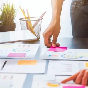 Teamwork brainstorming meeting and new startup project in workplace, quality successful work concept, vintage effect.