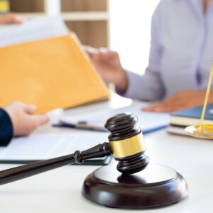 Women lawyer discussing with clients in courtroom. justice and l