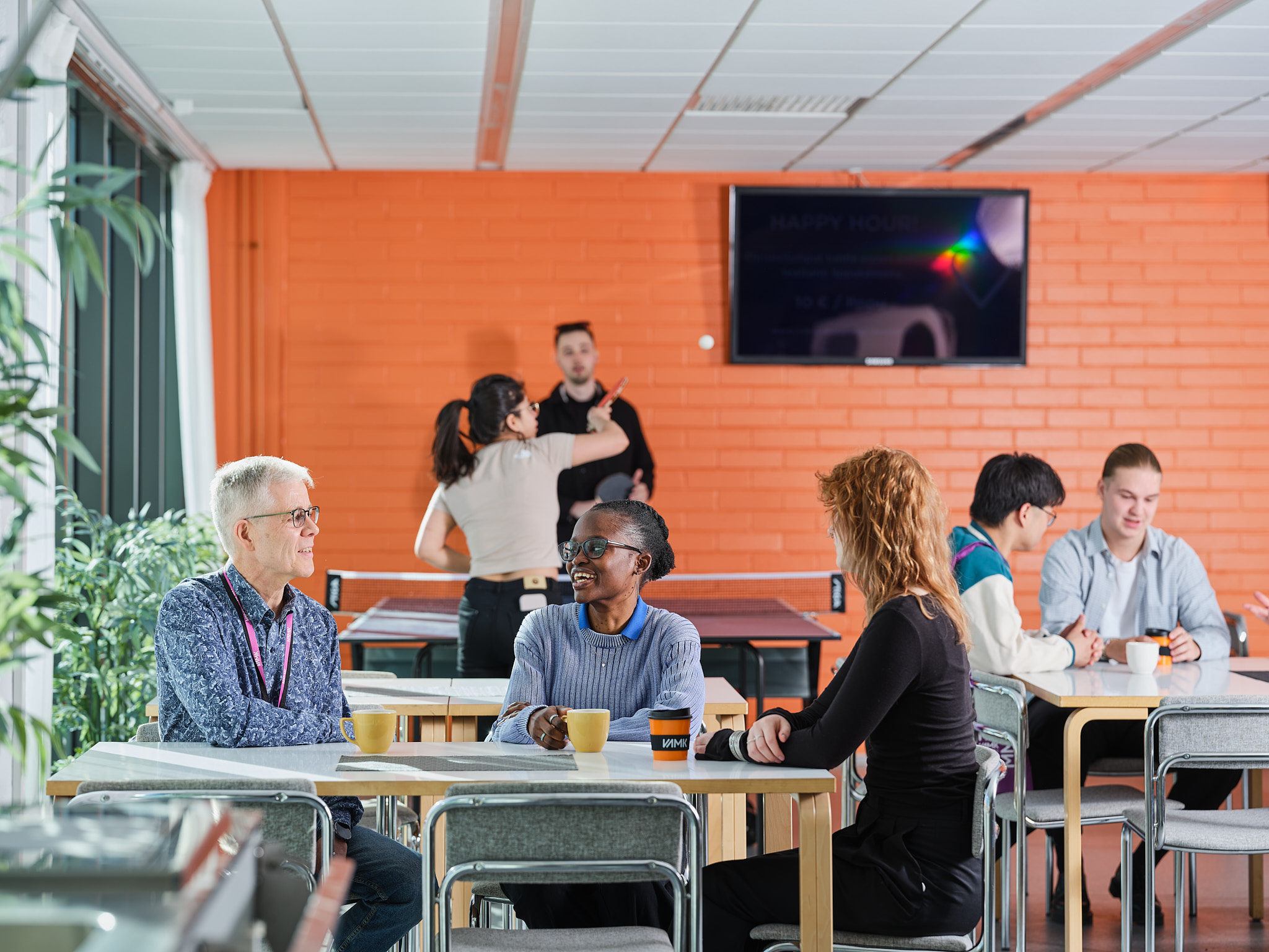 Students and staff discussing